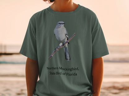 Northern Mockingbird, State Bird of Florida design on a green t-shirt.
