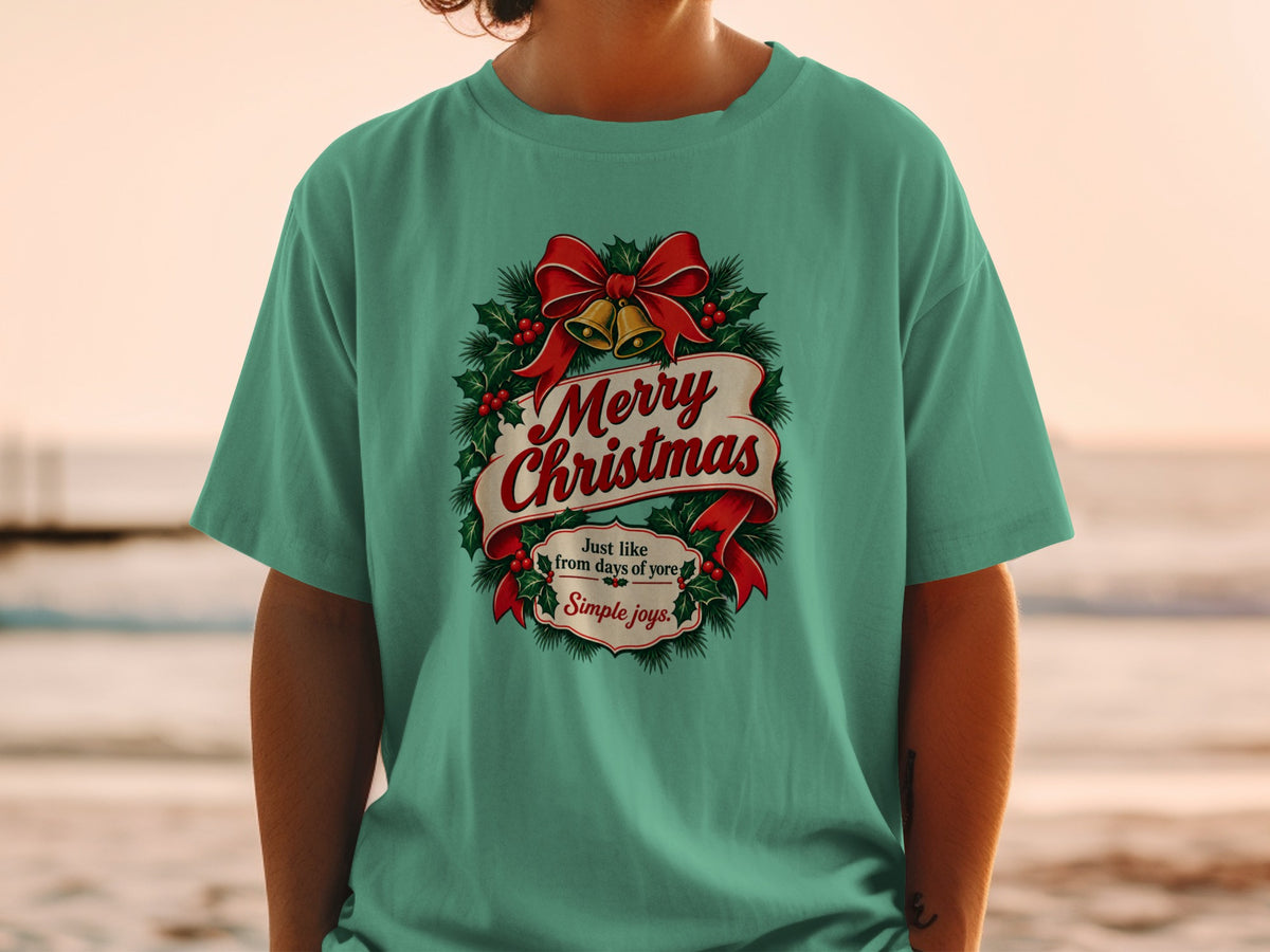 Green t-shirt with "Merry Christmas" and "Simple joys" text and Christmas wreath design.