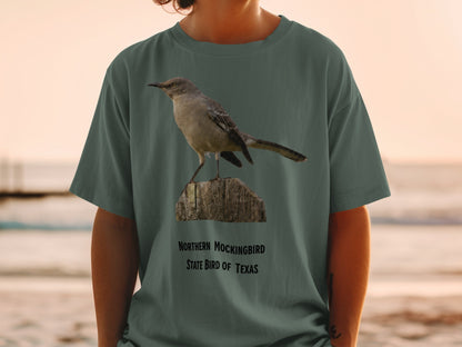 Northern Mockingbird, State Bird of Texas graphic on green t-shirt.