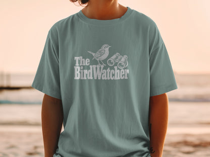 Gray t-shirt with "The BirdWatcher" text, bird, and binoculars graphic.