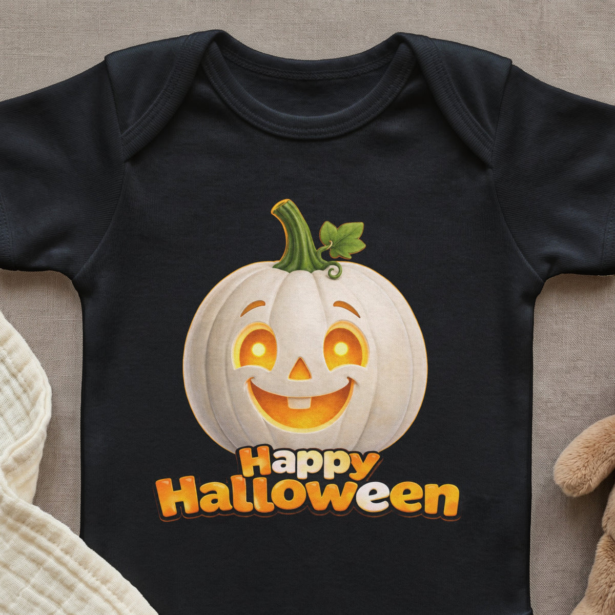 Black baby onesie with a smiling white pumpkin and "Happy Halloween" text.
