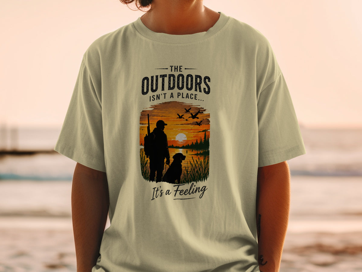 T-shirt graphic with text "The Outdoors Isn't a Place... It's a Feeling."