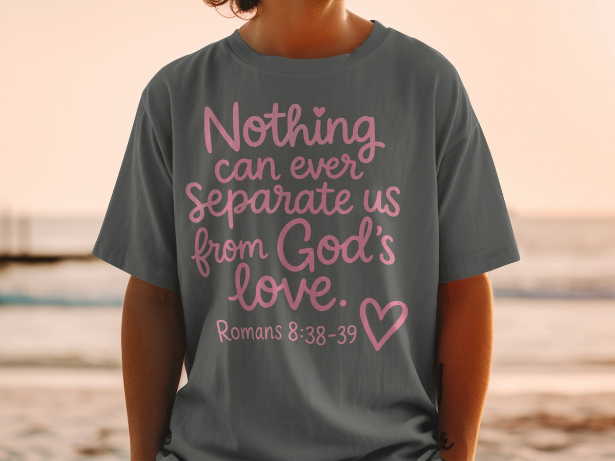 Dark grey t-shirt with pink text "Nothing can ever Separate us from God's love. Romans 8:38-39".