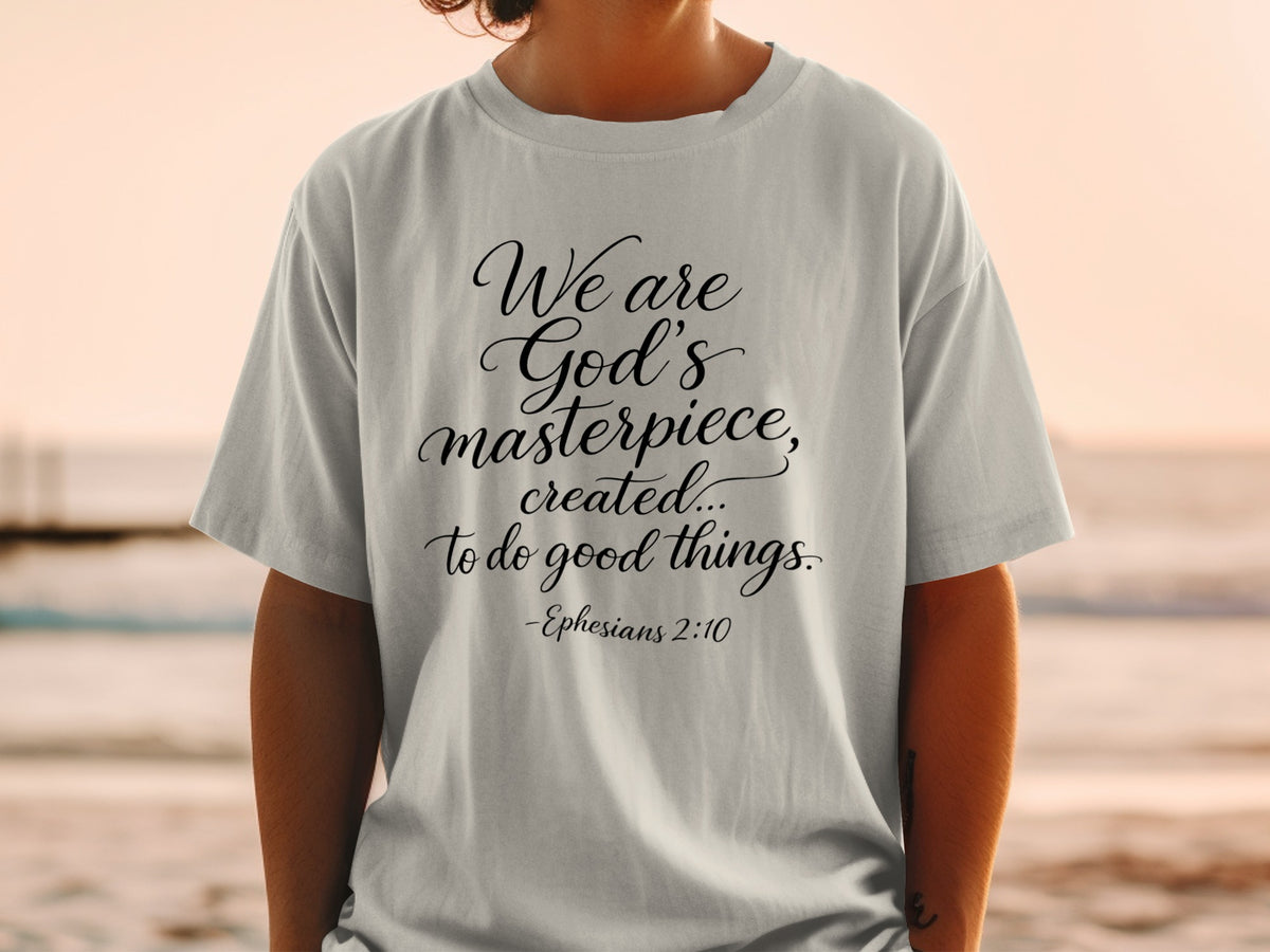 Light grey t-shirt with text "We are God's masterpiece, created... to do good things. -Ephesians 2:10".
