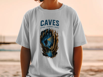 Graphic tee with "CAVES" text and explorer in a cave illustration.