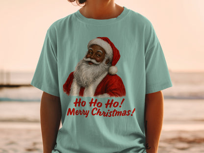 Santa Claus illustration with "Ho Ho Ho! Merry Christmas!" text on a light blue t-shirt.