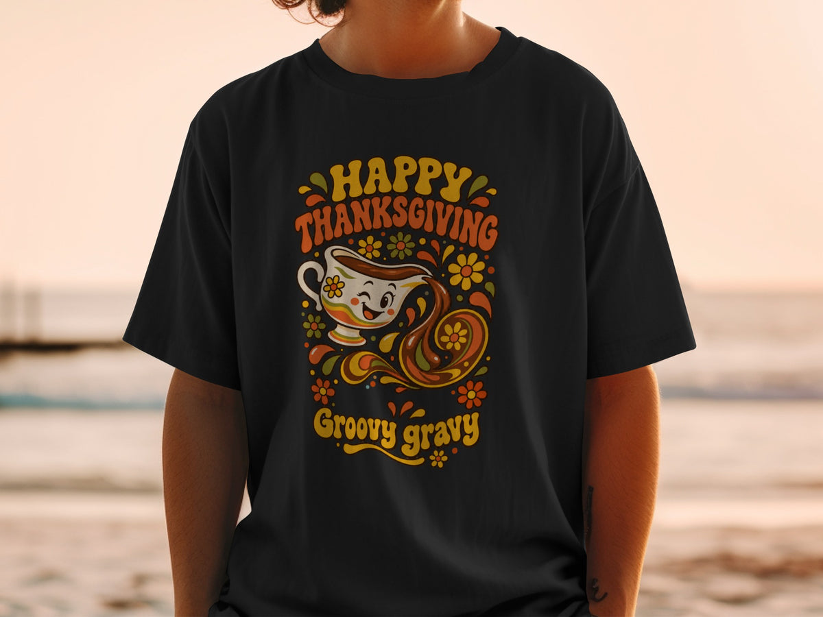 Black t-shirt with "Happy Thanksgiving Groovy Gravy" text and retro gravy boat graphic.