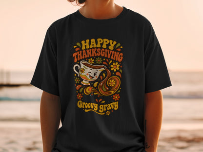 Black t-shirt with "Happy Thanksgiving Groovy Gravy" text and retro gravy boat graphic.