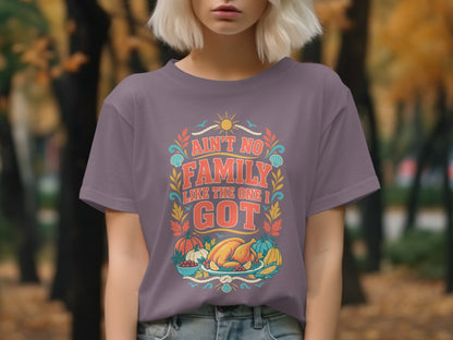 Purple t-shirt with "Ain't No Family Like The One I Got" text and Thanksgiving food illustration.