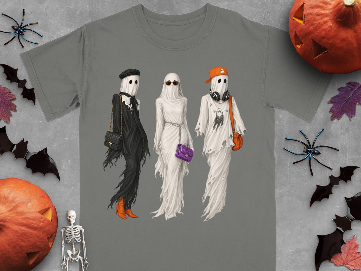 Three ghosts dressed in fashionable Halloween outfits, with pumpkins and spiders.