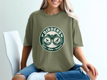 Green t-shirt with "BIRDERS Spot • Note • Repeat" text and binoculars graphic.