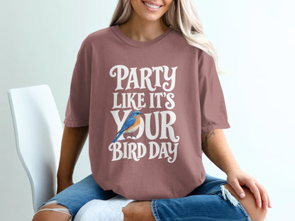 Mauve t-shirt with white text "Party Like It's Your Bird Day" and a blue bird.