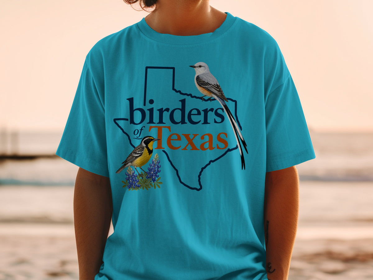 Teal t-shirt with outline of Texas and two birds: "birders of Texas" text.