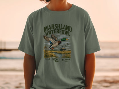 Green t-shirt with "Marshland Waterfowl" and a flying duck graphic.