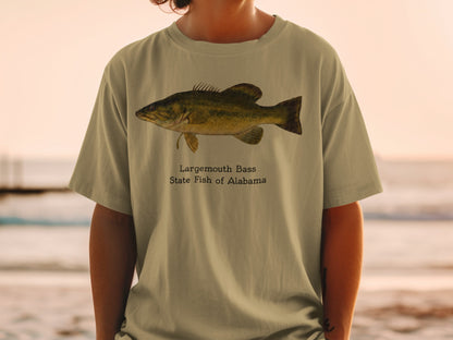 Largemouth Bass, State Fish of Alabama graphic on tan t-shirt.