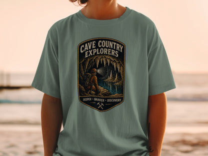 Cave Country Explorers graphic with speleologist exploring a cave with stalactites and underground lake.