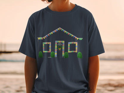 Dark t-shirt with illustration of a house decorated with colorful Christmas lights.