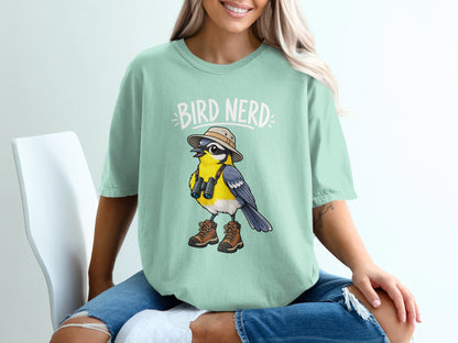 Mint green t-shirt with "BIRD NERD" text and cartoon bird with binoculars and boots.