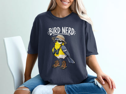 Dark blue t-shirt with cartoon bird wearing hat, binoculars, and boots. Text "BIRD NERD".