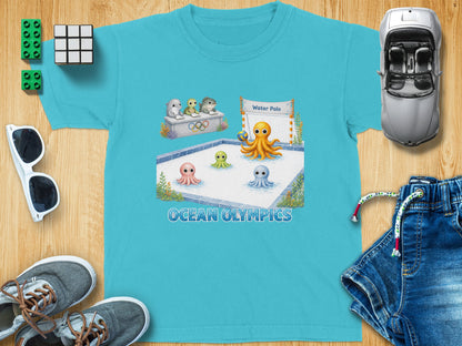 Blue t-shirt with "Ocean Olympics" graphic showing octopuses playing water polo.