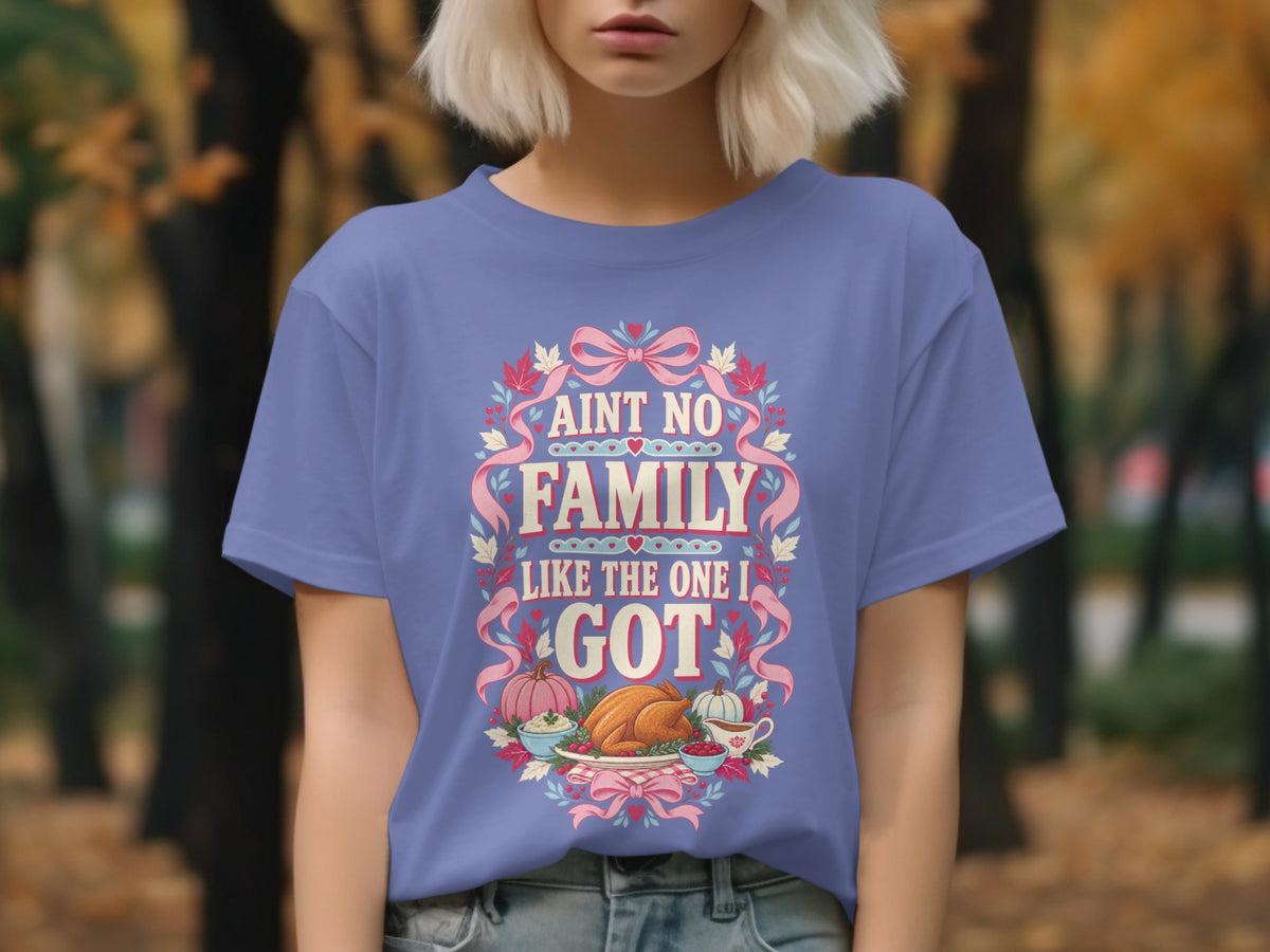 Purple t-shirt with "Ain't No Family Like The One I Got" and Thanksgiving feast graphic.