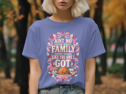 Purple t-shirt with "Ain't No Family Like The One I Got" and Thanksgiving feast graphic.