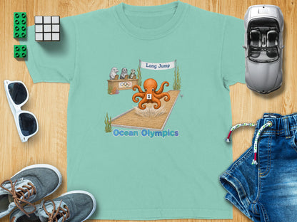 Teal t-shirt with octopus in long jump event at Ocean Olympics.