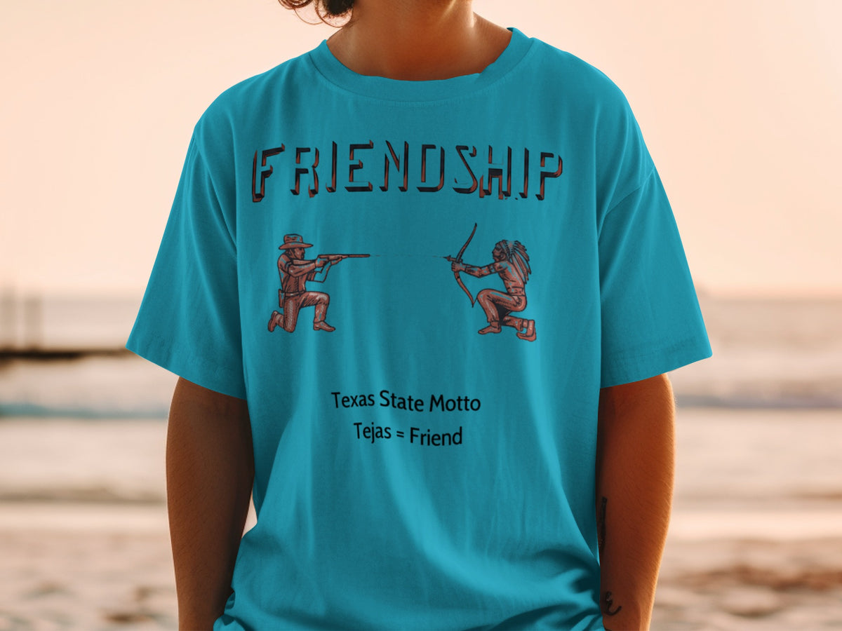 Turquoise shirt with "FRIENDSHIP" above a cowboy and Native American, and "Texas State Motto Tejas = Friend".