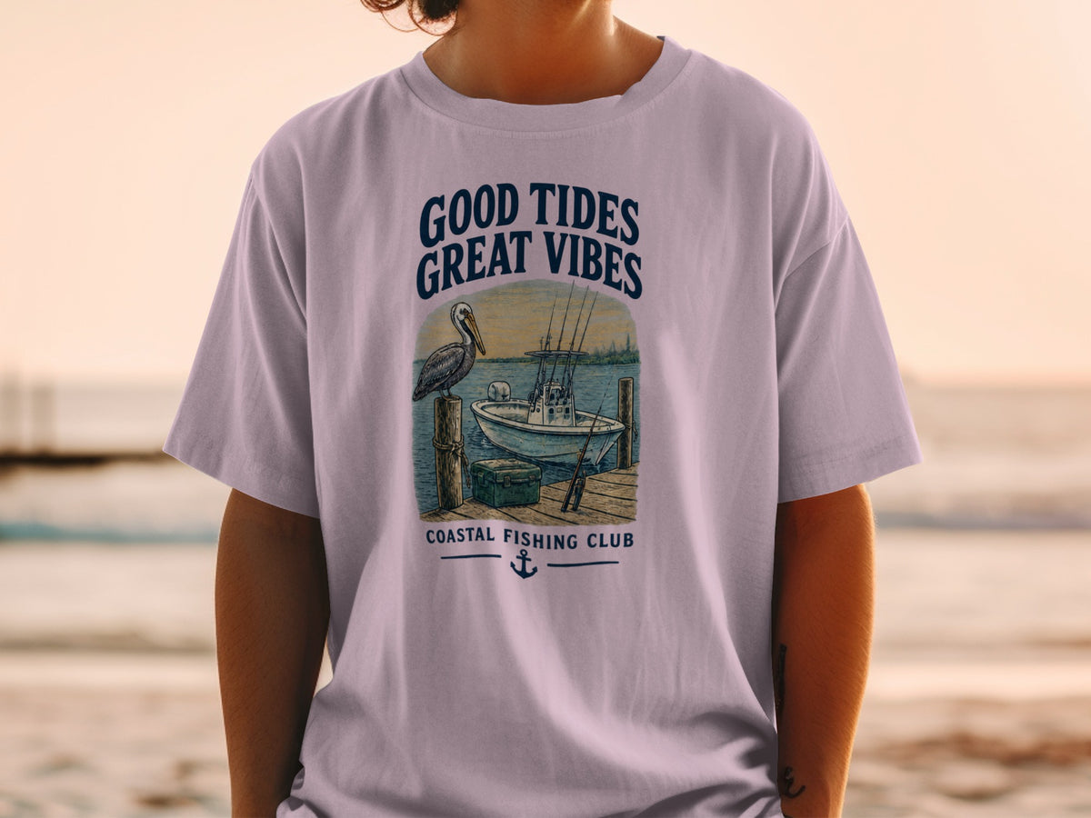 Light purple t-shirt with "GOOD TIDES GREAT VIBES" and "COASTAL FISHING CLUB" graphics.