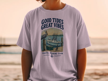 Light purple t-shirt with "GOOD TIDES GREAT VIBES" and "COASTAL FISHING CLUB" graphics.