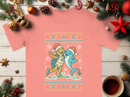 T-shirt with a festive cartoon turtle and dolphin wearing Santa hats and surrounded by snowflakes.