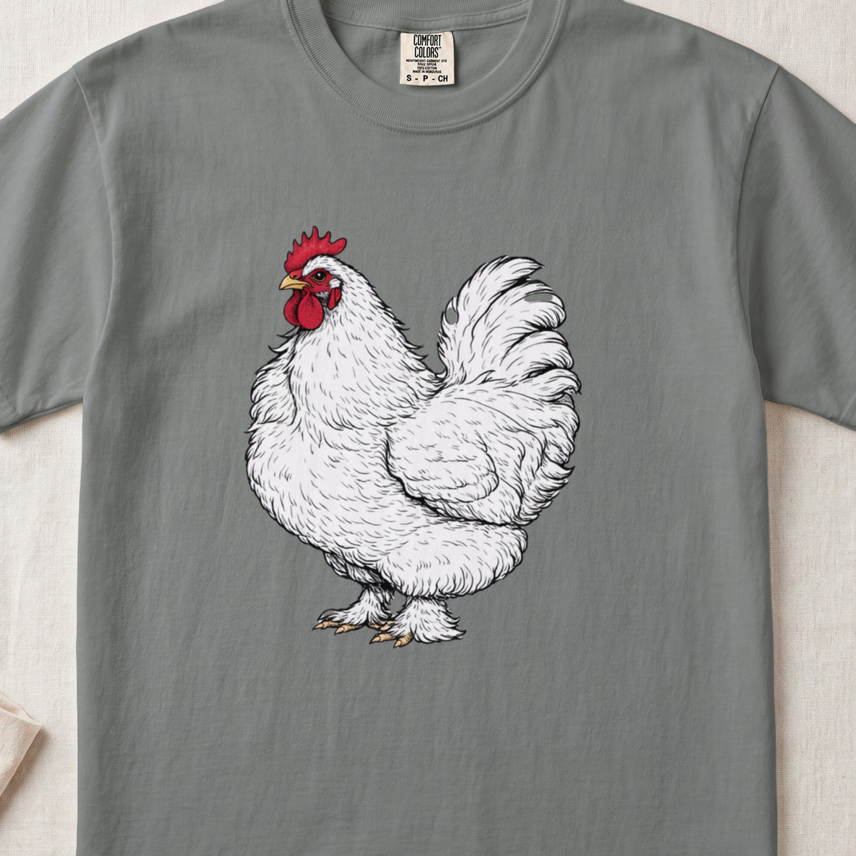 Gray crewneck t-shirt featuring an illustration of a fluffy white rooster with a red comb.