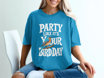 Blue t-shirt with white text "PARTY LIKE IT'S YOUR BIRDDAY" and a bluebird on a branch.