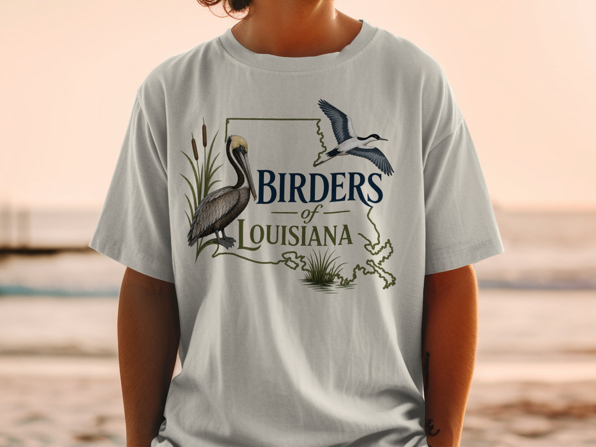 T-shirt graphic with pelican, bird, and "Birders of Louisiana" text.