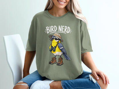 Green t-shirt with cartoon bird wearing hat, binoculars, and hiking boots, text "BIRD NERD".
