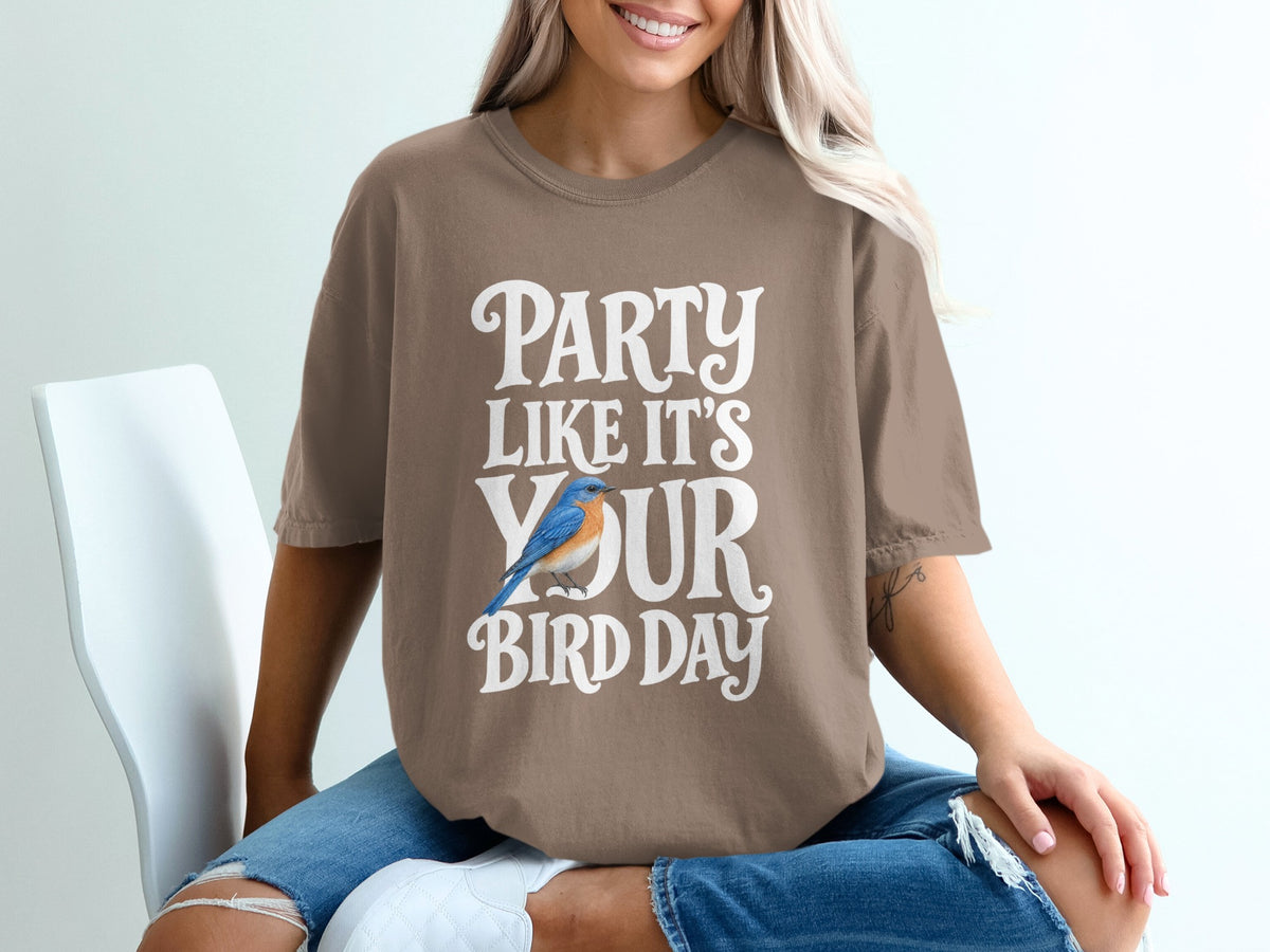 Brown t-shirt with "Party Like It's Your Bird Day" text and bluebird graphic.