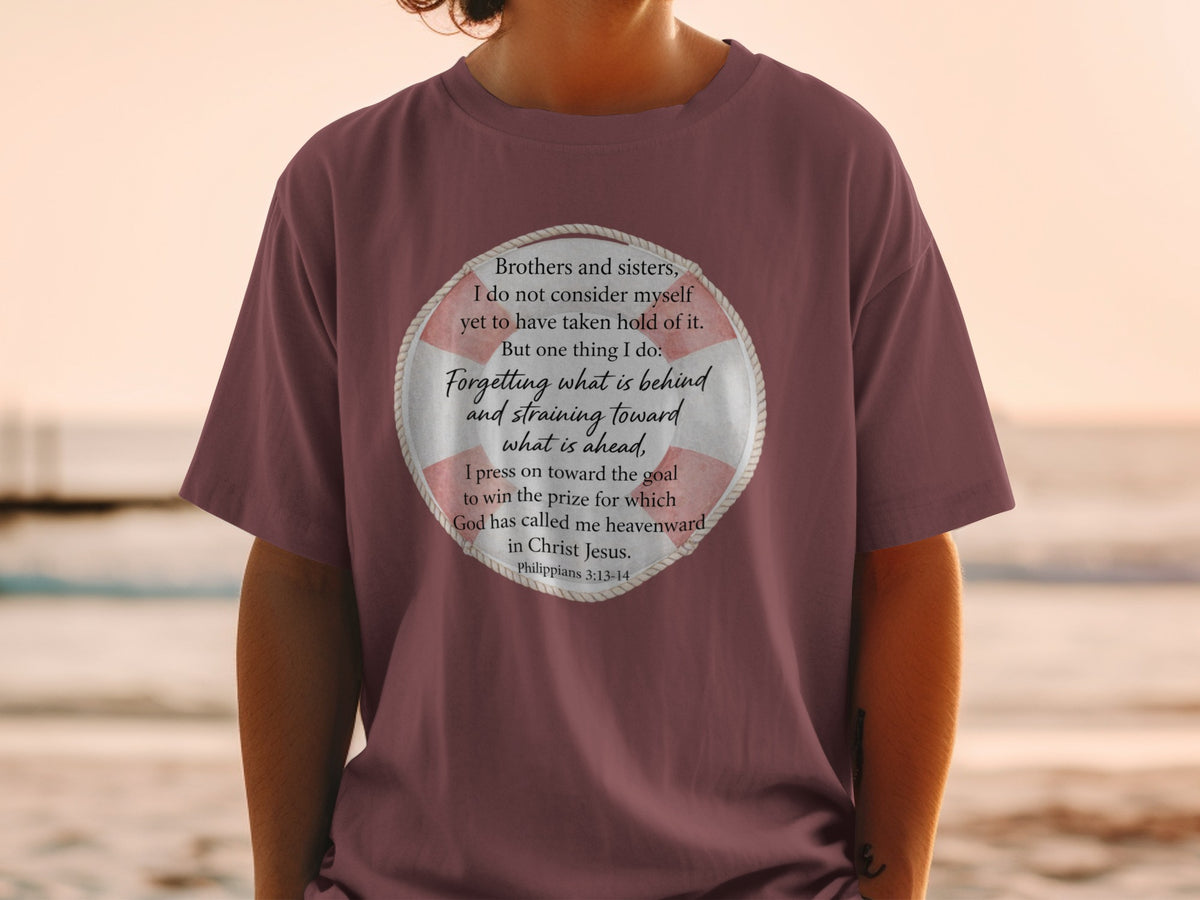 Maroon t-shirt with a life preserver graphic featuring Philippians 3:13-14 text.