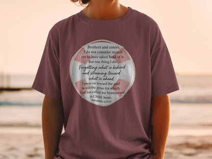 Maroon t-shirt with a life preserver graphic featuring Philippians 3:13-14 text.