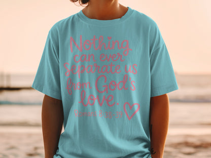 Teal t-shirt with pink text "Nothing can ever Separate us from God's love. Romans 8:38-39"