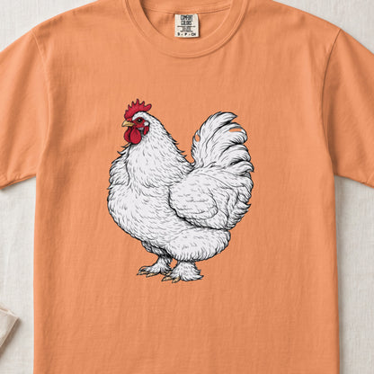 An orange crewneck t-shirt featuring a detailed illustration of a fluffy white rooster centered on the chest.