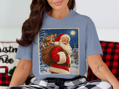 Vintage style Santa carrying a sack of toys through a snowy village at night.