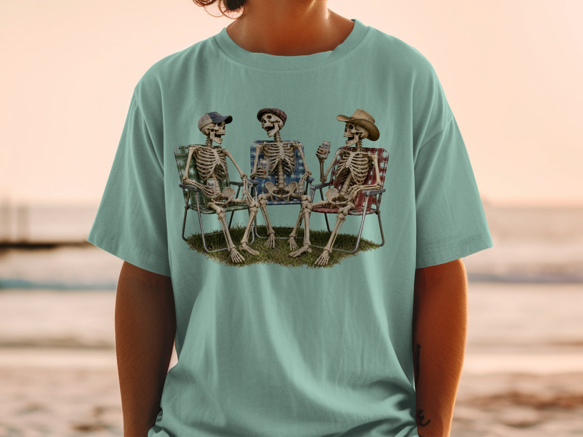 Three skeletons relax in lawn chairs holding drinks.