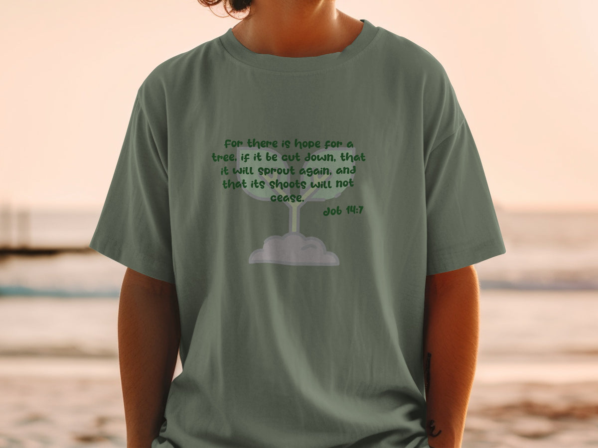Green t-shirt with text from Job 14:7 and a sprout illustration.