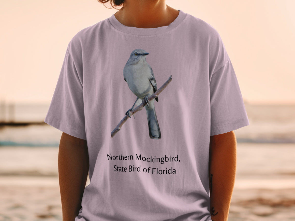 Northern Mockingbird, State Bird of Florida graphic on a purple t-shirt.