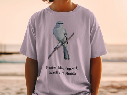 Northern Mockingbird, State Bird of Florida graphic on a purple t-shirt.