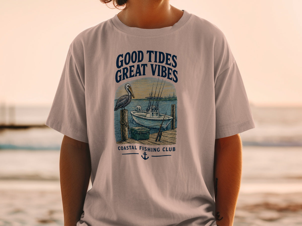 T-shirt with "Good Tides Great Vibes" graphic featuring a pelican, fishing boat, and dock.