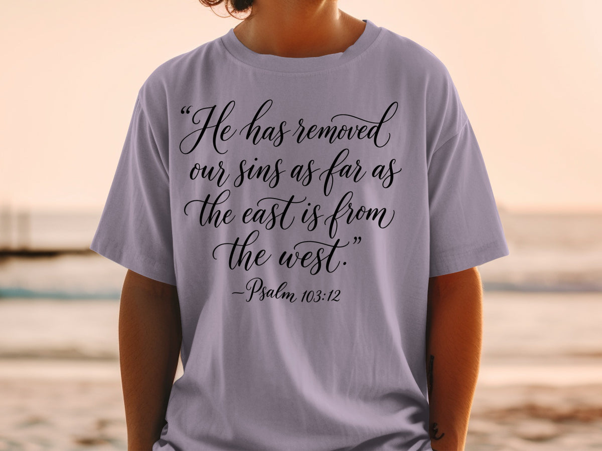 Purple t-shirt with black text: "He has removed our sins as far as the east is from the west." -Psalm 103:12