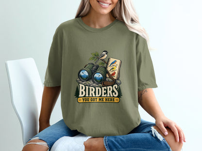 Binoculars and notebook with birds, text "Birders You Got Me Here".