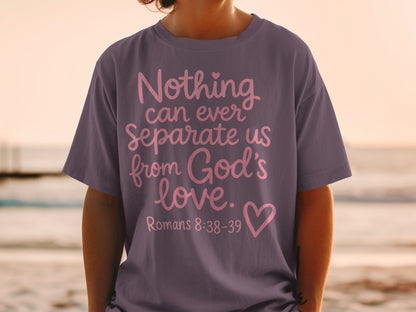 Purple t-shirt with pink text "Nothing can ever separate us from God's love. Romans 8:38-39" and a heart.