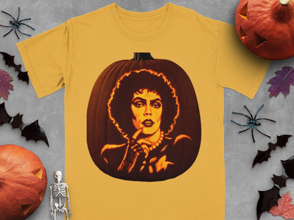 Gold t-shirt featuring a lit jack-o-lantern carved with Dr. Frank-N-Furter, surrounded by Halloween decorations.